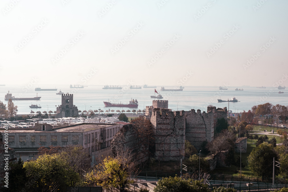 Yedikule, Istanbul, Turkey - December 2021: Thousands of years old Yedikule Fortress and Dungeons. Yedikule Fortress and Marmara Sea view. Selective focus.