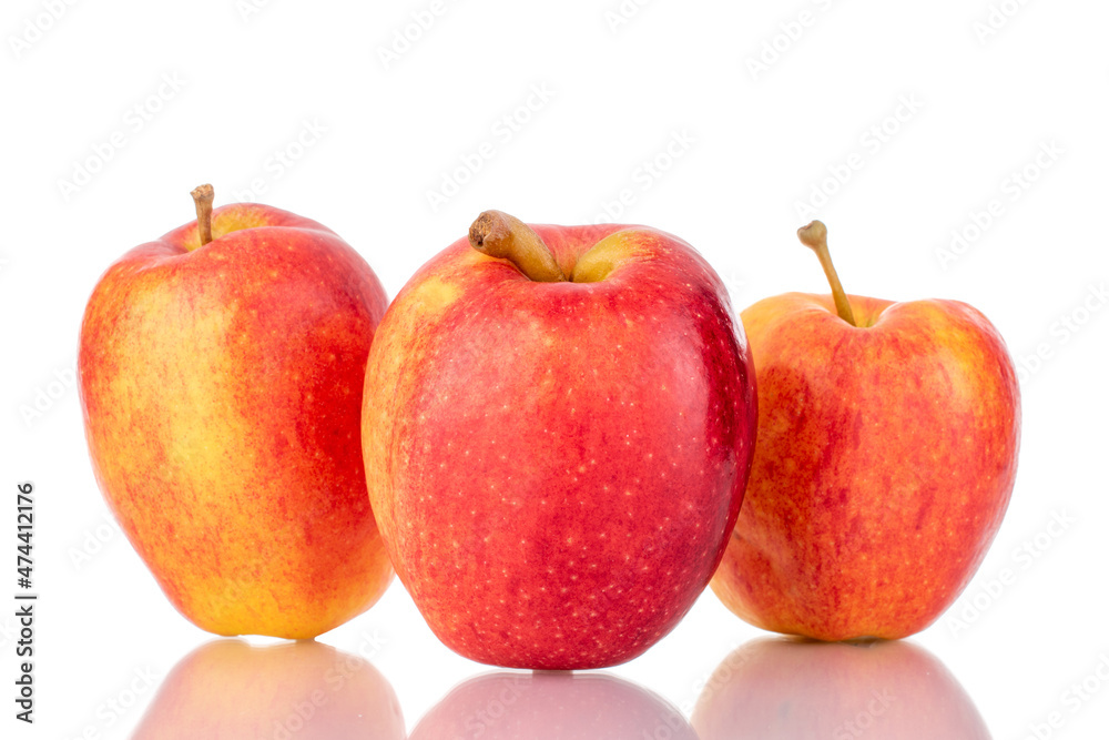 Three ripe juicy apples, close-up, isolated on white. Three ripe juicy apples, close-up, isolated on white.