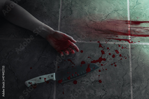 Valokuvatapetti Big sharp kitchen knife with blood, female hand of victim and bloody traces