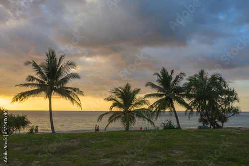 Scene of Colorful romantic sky sunset with coconuts in sunset background.cloud in sunset on Karon beach Phuket Thailand. .Scene of Colorful yellow light in the sky background.