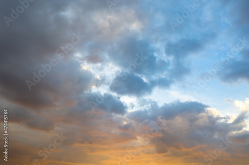 Majestic sunset or sunrise landscape Amazing light of nature .cloudscape sky and clouds moving away rolling above the yellow sun.