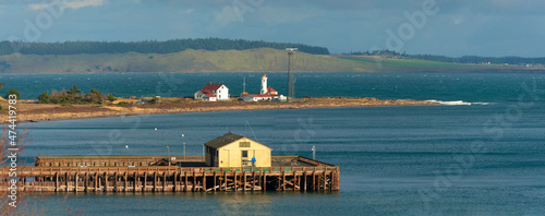 Point Wilson Lighthouse. It marks the western side of the entrance to Admiralty Inlet from the Strait of Juan de Fuca and is an important landmark for vessels traveling to and from Puget Sound. photo