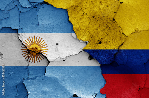 flags of Argentina and Colombia painted on cracked wall