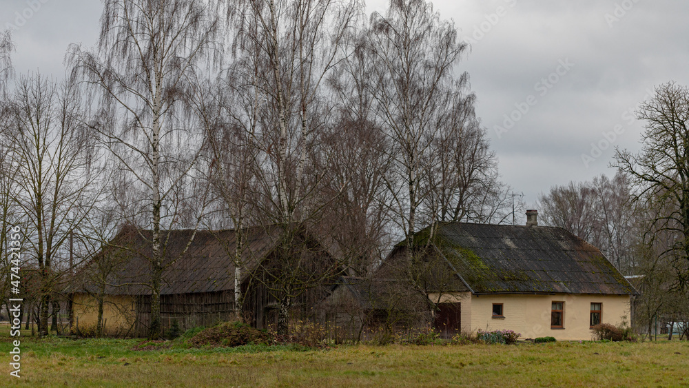 village houses in Latvian countryside. Autumn evening village houses in Latvian countryside. Autumn evening