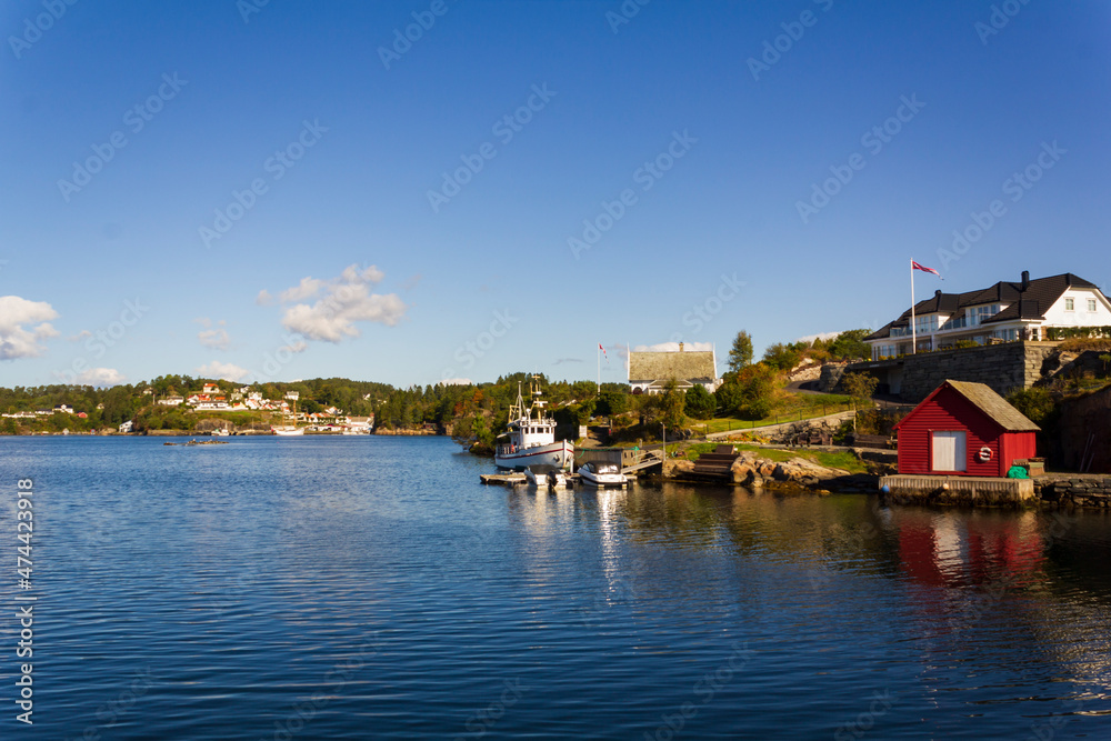 Residential area in Norway with villas and yachts by the sea