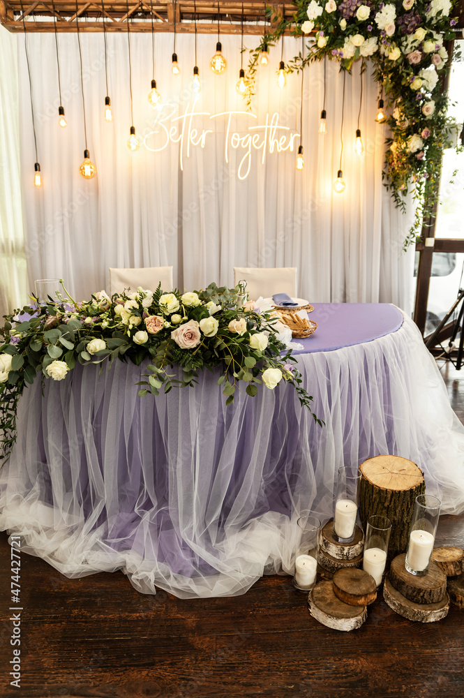 a beautiful arch at the wedding ceremony decorated with flowers stands on the outside. wedding decorations in rustic style. a beautiful arch at the wedding ceremony decorated with flowers stands on the outside. wedding decorations in rustic style.