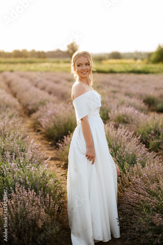 the bride in a white dress on the lavender field