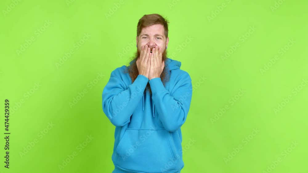 Redhead man with long beard keeping the arms crossed in confident expression over isolated background Redhead man with long beard keeping the arms crossed in confident expression over isolated background