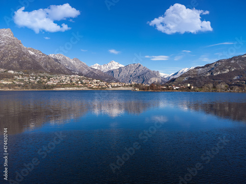 Beautiful reflection of Mountains and clouds in lake water © afinocchiaro