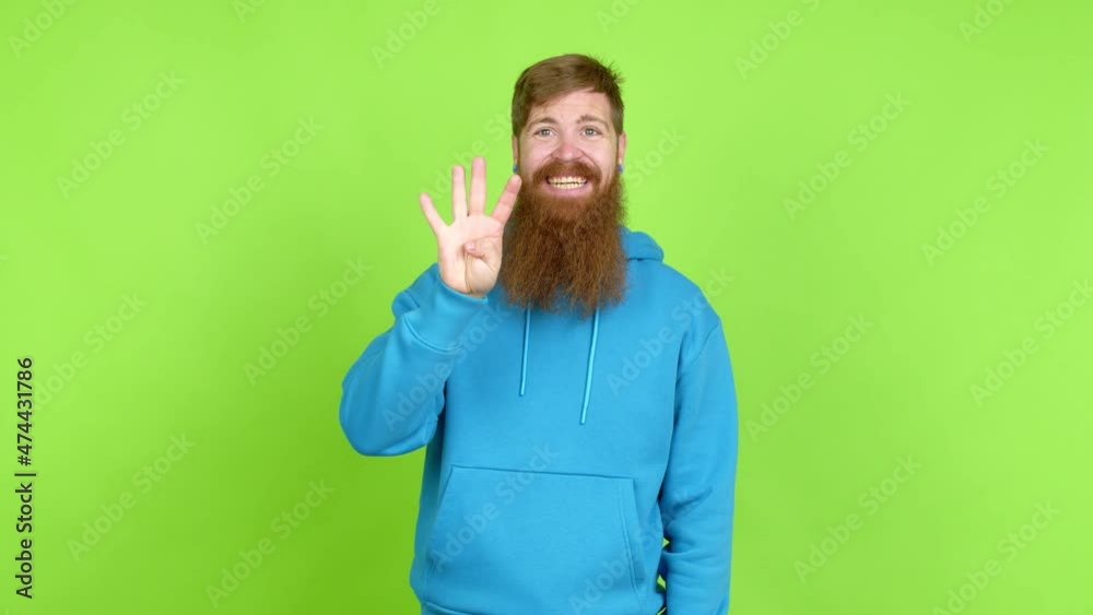 Redhead man with long beard happy and counting with fingers over isolated background Redhead man with long beard happy and counting with fingers over isolated background