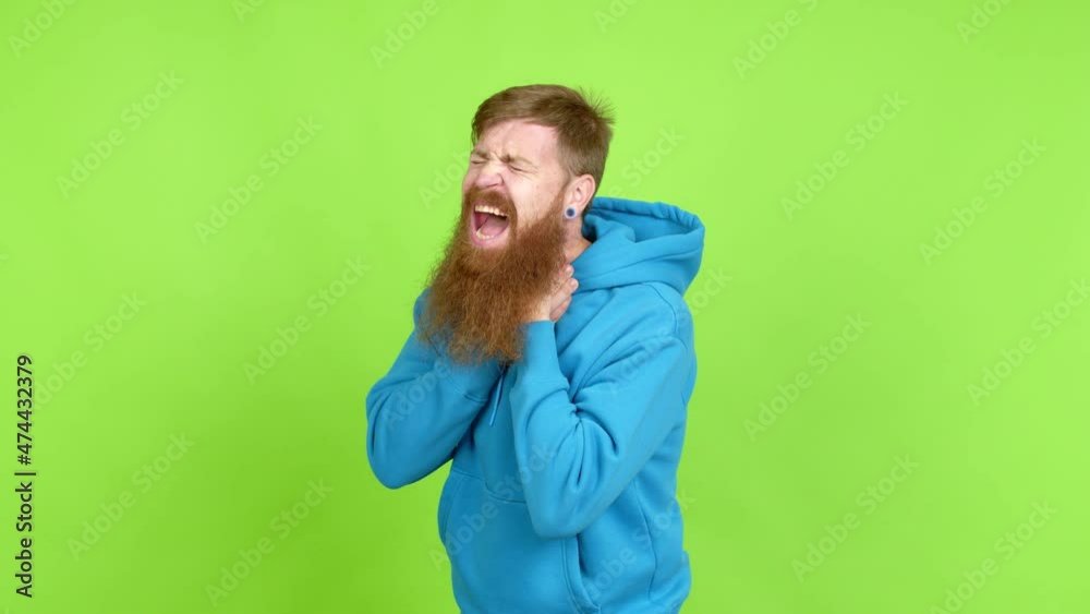 Redhead man with long beard with sore throat over isolated background Redhead man with long beard with sore throat over isolated background