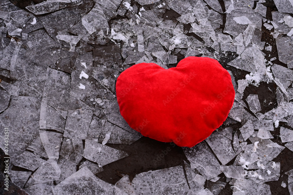 red heart in shards of ice. Unrequited love, infidelity. Valentine's day red heart in shards of ice. Unrequited love, infidelity. Valentine's day