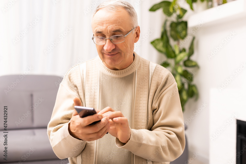 Close up of man hands using smartphone over white table