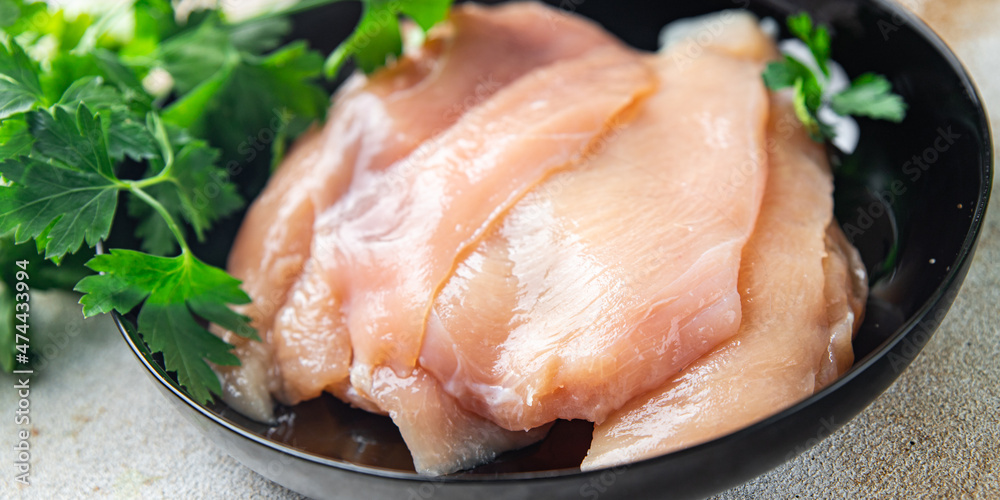 raw chicken breast slices poultry meat healthy meal diet snack on the table copy space food background rustic. top view keto or paleo diet raw chicken breast slices poultry meat healthy meal diet snack on the table copy space food background rustic. top view keto or paleo diet