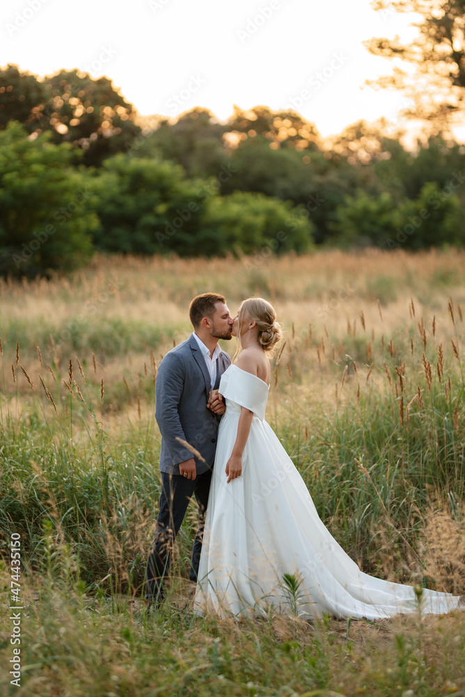 bride and groom on in the woods