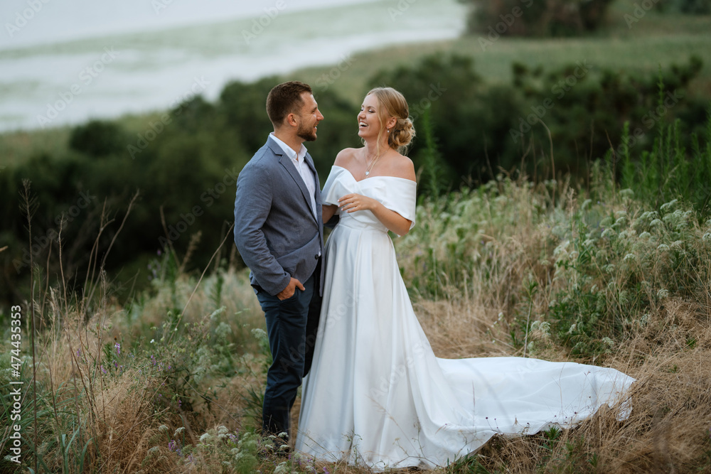 bride and groom on in the woods