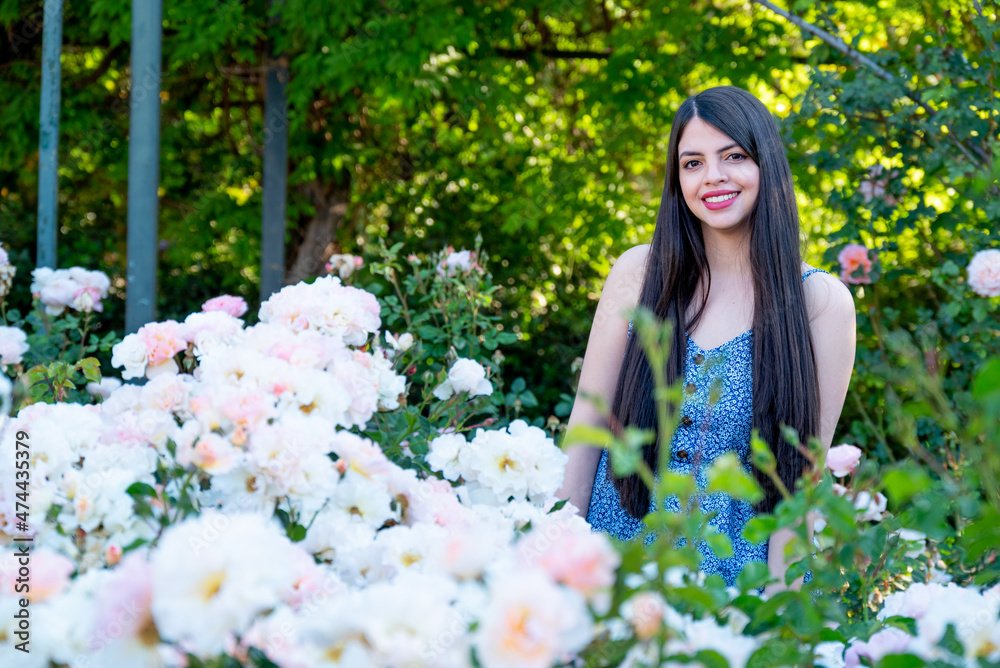 Young woman portrait with spring flowers at park Young woman portrait with spring flowers at park