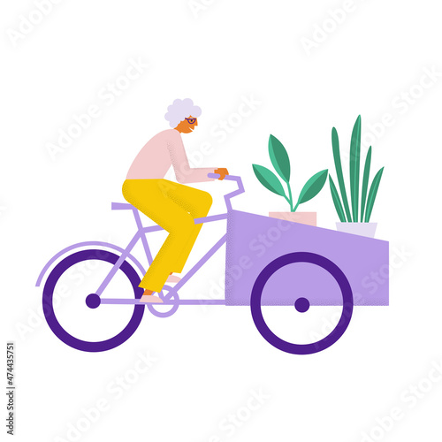 Elderly woman riding cargo bike with plants. Grandmother transports carries her staff on bakfiets bicycle