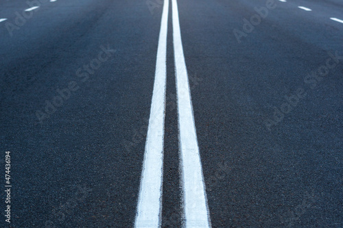 The asphalted road. The highway with a white marking. © O.PASH