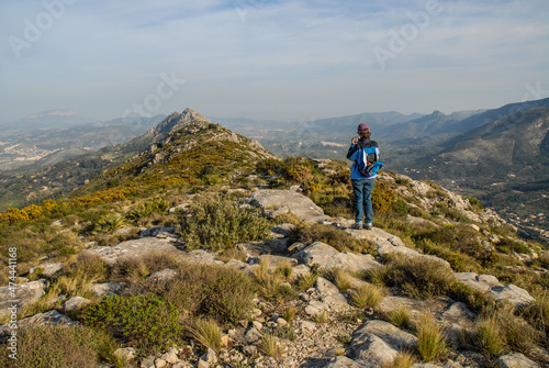 hiking in the mountains, on the Cavall Verd, near Benimaurell, Alicate Province, Spain photo