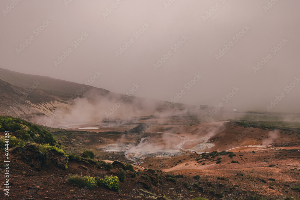 Empty geothermal Krysuvik area on Reykjanes peninsula in Iceland on early summer morning. Visible sulphur rising from the ground. Empty geothermal Krysuvik area on Reykjanes peninsula in Iceland on early summer morning. Visible sulphur rising from the ground.