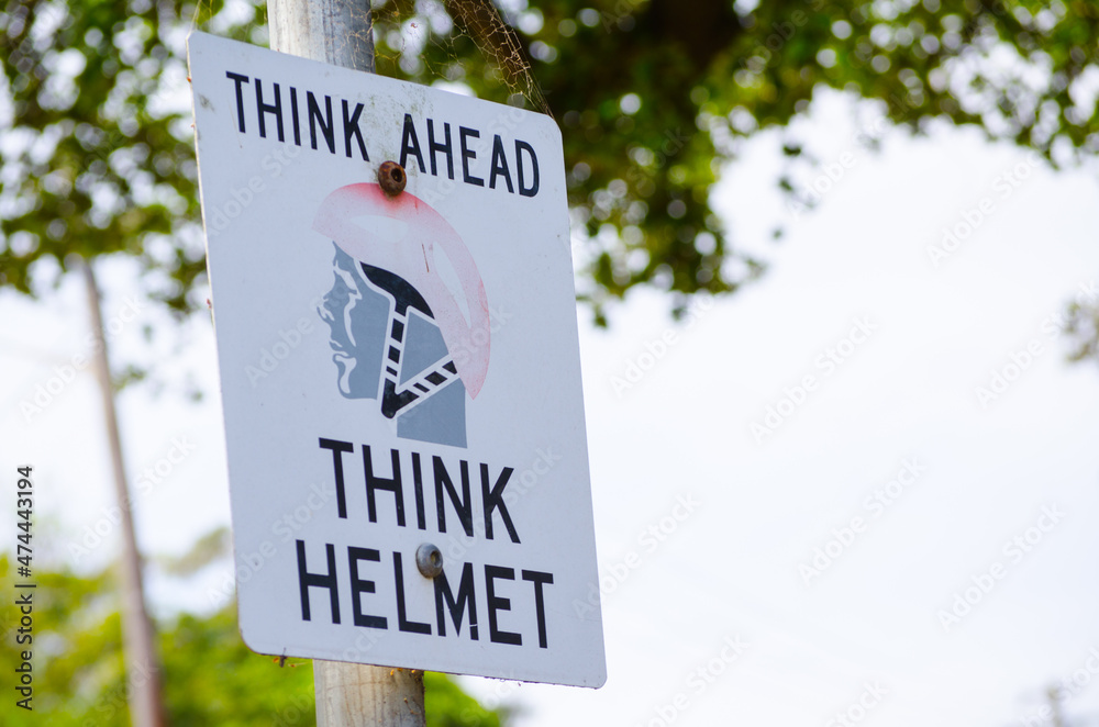 Think ahead think helmet warning sign.