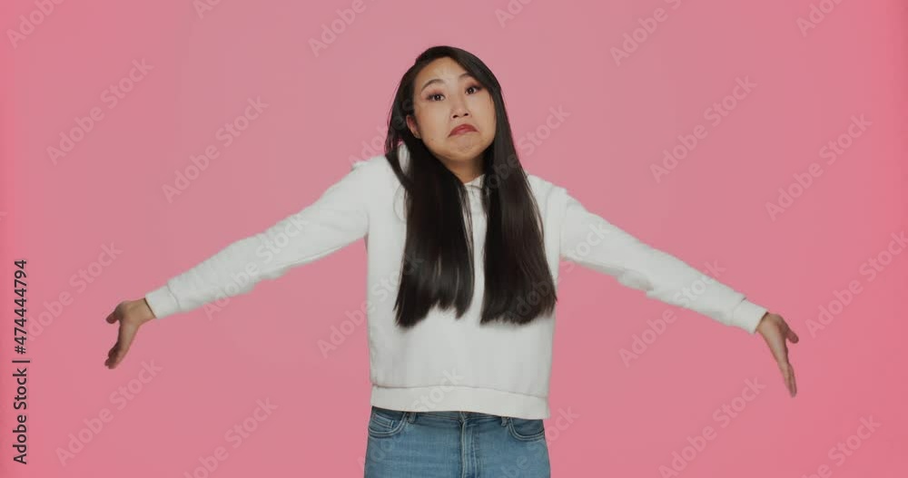 Confused helpless young cute asian girl shrugging shoulders dont know answer. Uncertainty, dilemma, ignorance