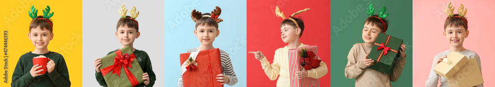 Funny little boy with reindeer horns and Christmas gift on color background Funny little boy with reindeer horns and Christmas gift on color background