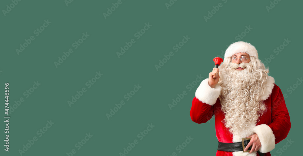Santa Claus with Christmas bell on green background with space for text Santa Claus with Christmas bell on green background with space for text