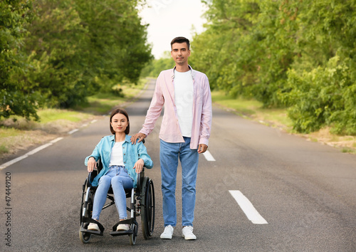 Young woman with physical disability and her husband outdoors