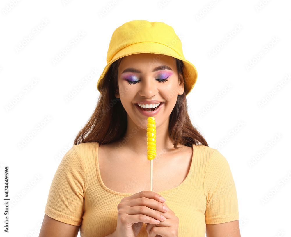 Young woman in bucket hat with lollipop on white background Young woman in bucket hat with lollipop on white background