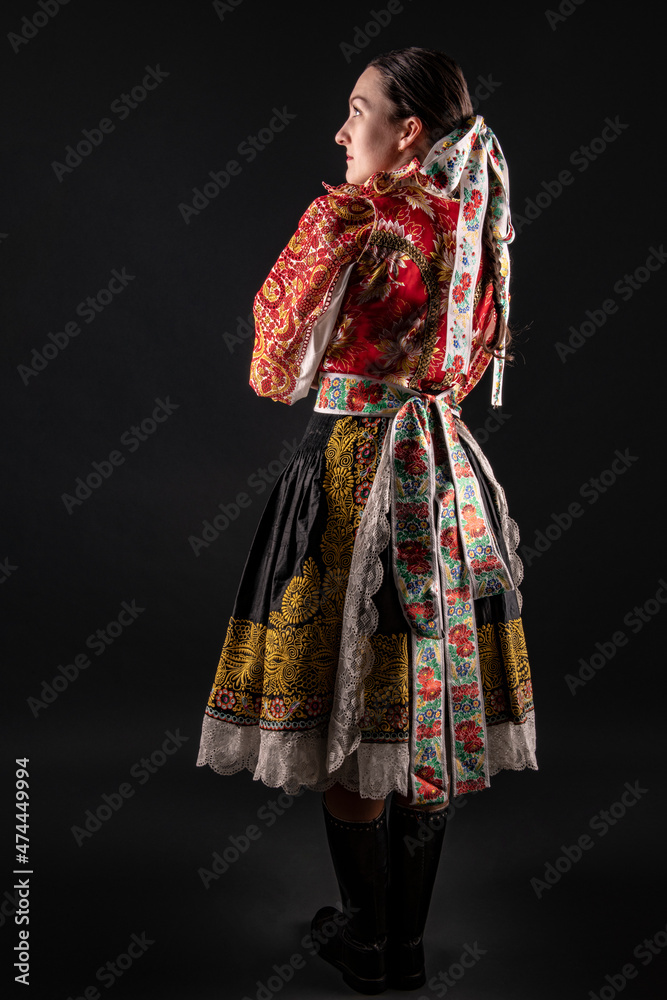 Fototapeta premium Young beautiful slovak woman in traditional dress. Slovak folklore