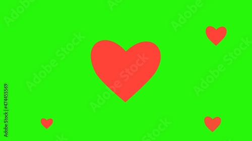 Red heart flying on green background, perfect for opening valentine videos.