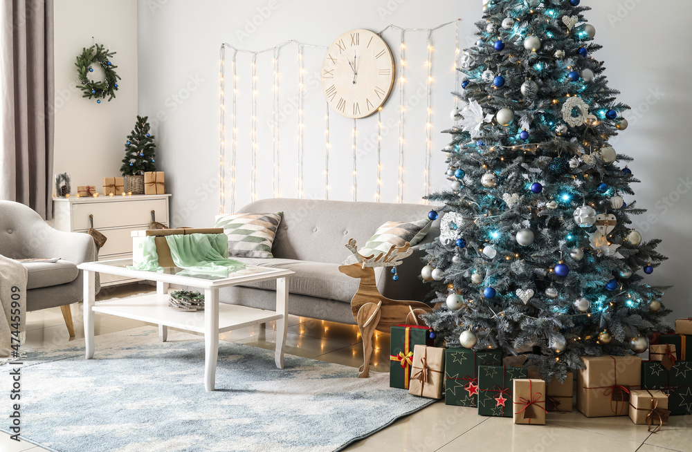 Stylish interior of living room with Christmas tree