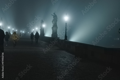 Street lamps and light from them on the old stone Charles Bridge in the night fo Fototapet