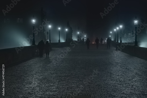 Photography Street lamps and light from them on the old stone Charles Bridge in the night fo