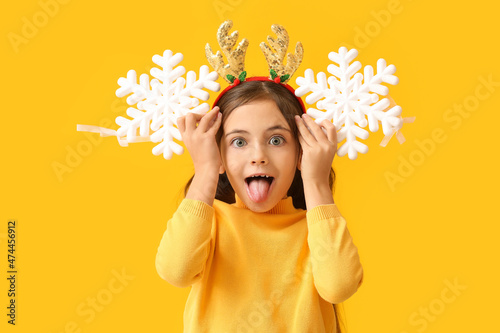 Funny little girl with rein...
