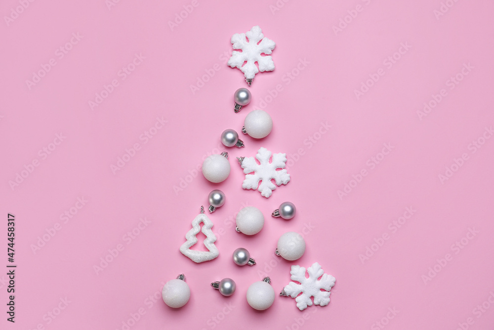 Christmas tree made of decorations on pink background Christmas tree made of decorations on pink background