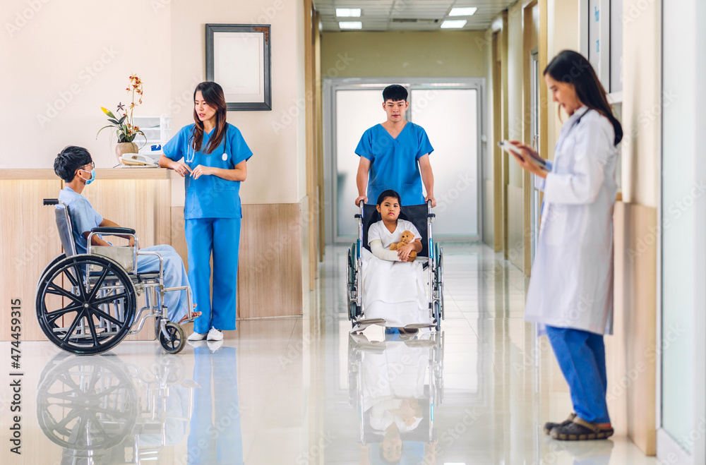 Fototapeta premium Group of professional medical doctor team work with stethoscope in uniform working discussing and talk walking in hospital.health medical care concept