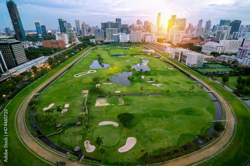 City view of green stadium field of horserunner in the Bangkok