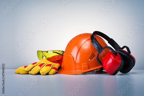 Personal Protective Equipment On Grey Background. Work Safety Concept.