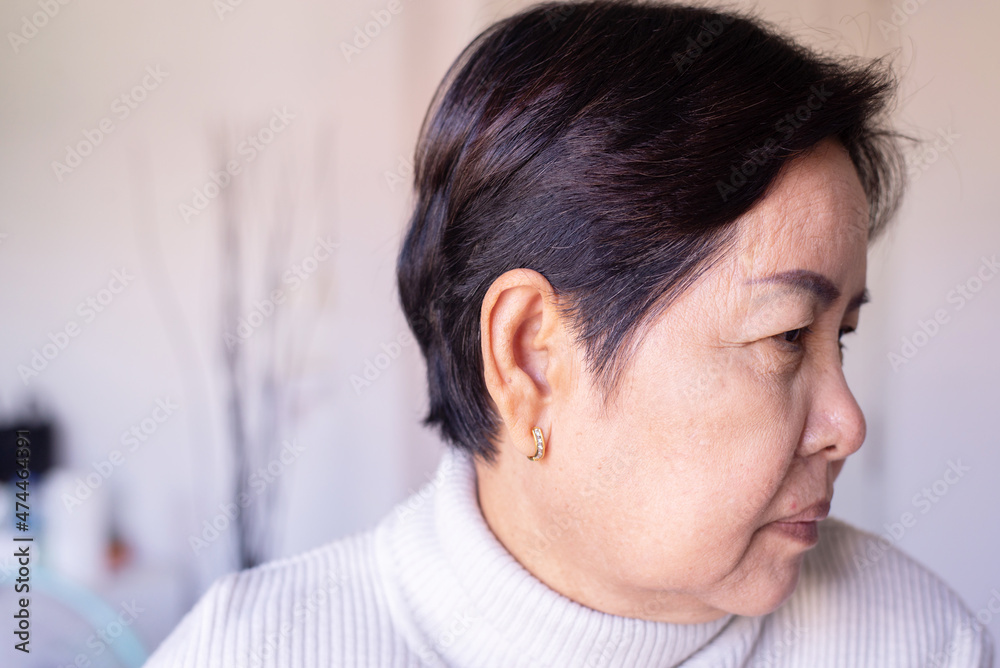 Senior woman showing black gray hair roots on her head,Close up Senior woman showing black gray hair roots on her head,Close up