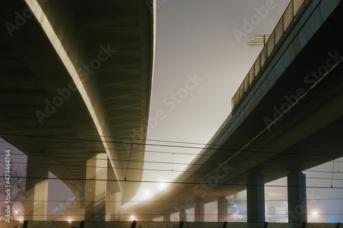 street lights under a concrete bridge in the fog in the city of Prague at night 2021