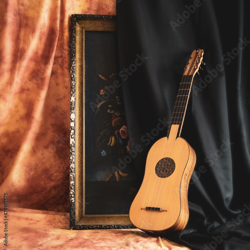 Musical still life in the Renaissance style with renaissance guitar