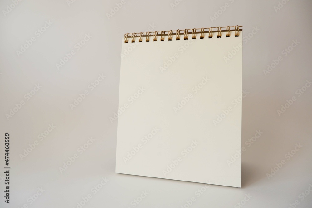 A paper white calendar stands on the table. Mock Up Vector Template. Blank Calendar on white background. A paper white calendar stands on the table. Mock Up Vector Template. Blank Calendar on white background.