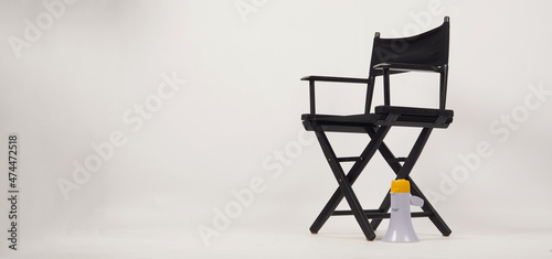 Fototapeta Naklejka Na Ścianę i Meble -  Black director chair and Clapper board with yellow megaphone on white background