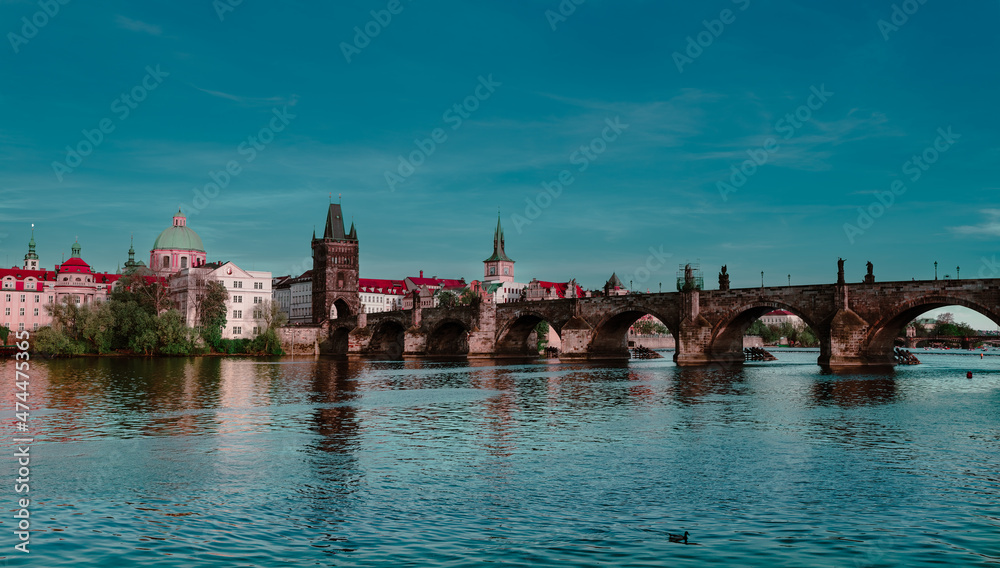 Panoramic view of Charles Bridge on the Vltava river in the center of Prague on a sunny day 2021 during storm