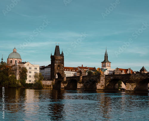 Panoramic view of Charles Bridge on the Vltava river in the center of Prague on a sunny day 2021 during storm © svetjekolem