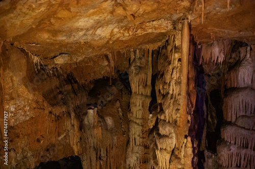 abstract background of stalactites, stalagmites and stalagnates in a cave, underground,