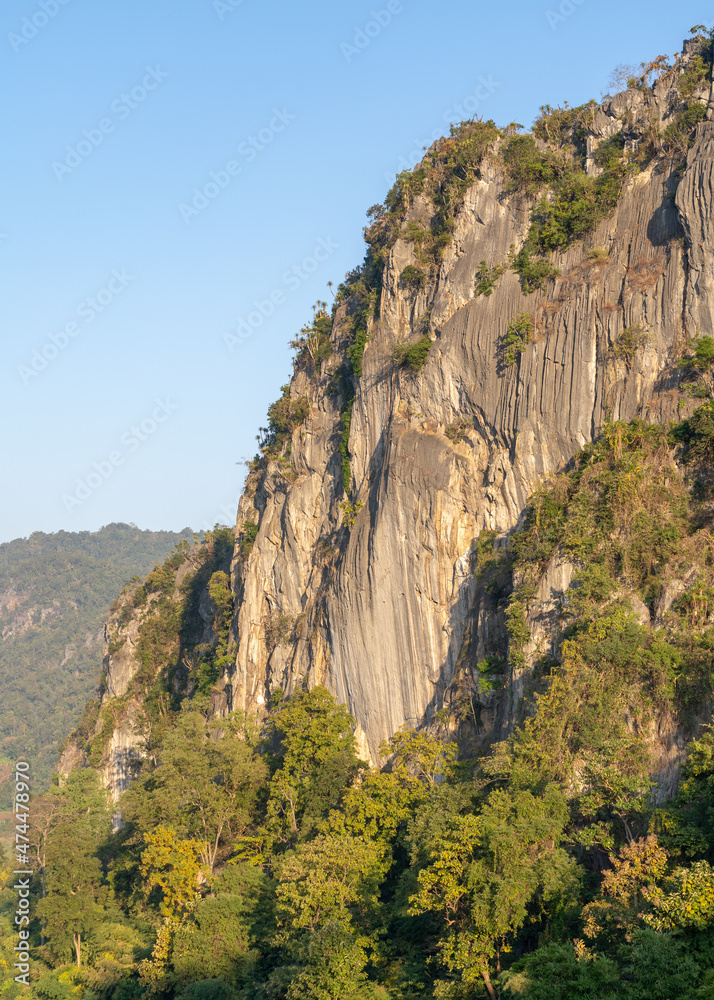 Scenic autumn morning landscape view of limestone or karst mountain and tropical vegetation in beautiful Chiang Dao countryside, Chiang Mai, Thailand